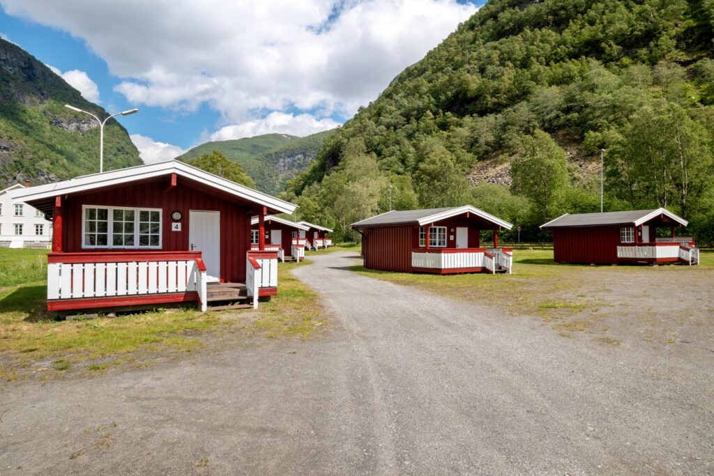Wooden cabins below the mountain walls in Utladalen